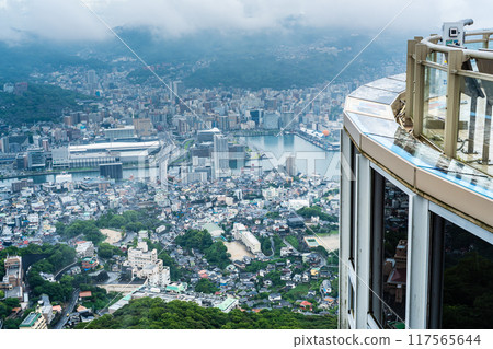 Nagasaki cityscape shrouded in mist and clouds from the Inasayama Observatory [Nagasaki City] 117565644