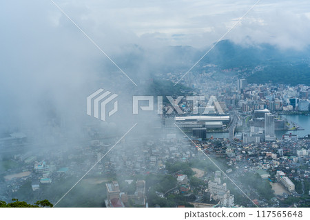Nagasaki cityscape shrouded in mist and clouds from the Inasayama Observatory [Nagasaki City] 117565648