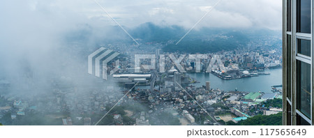 Panorama of Nagasaki cityscape shrouded in mist and clouds from the Inasayama Observatory [Nagasaki City] 117565649