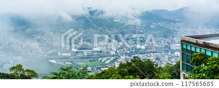 Panorama of Nagasaki cityscape shrouded in mist and clouds from the Inasayama Observatory [Nagasaki City] 117565685