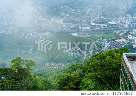 Nagasaki cityscape shrouded in mist and clouds from the Inasayama Observatory [Nagasaki City] 117565691