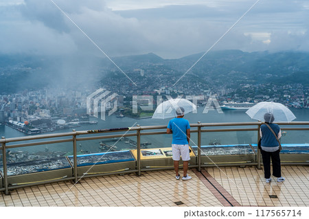 Nagasaki cityscape shrouded in mist and clouds from the Inasayama Observatory [Nagasaki City] 117565714