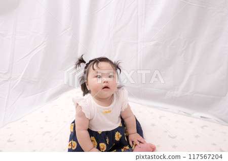 [Sitting baby with twin tails] 117567204