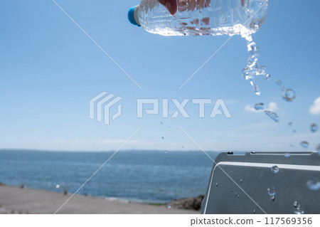 Remove the plastic bottle from the cooler Remove the plastic bottle from the cooler 117569356