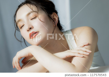 A woman in a white dress A woman in a white dress 117570543