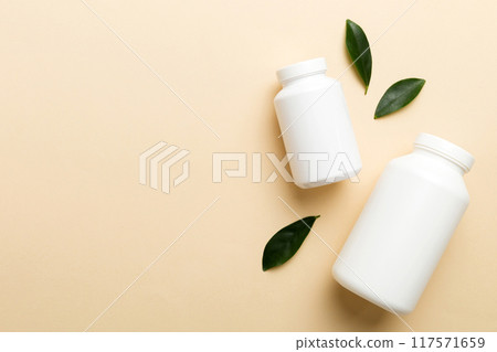 supplement pills with medicine bottle health care and medical top view. Vitamin tablets. Top view mockup bottle for pills and vitamins with green leaves, natural organic bio supplement, copy space supplement pills with medicine bottle health care and medical top view. Vitamin tablets. Top view mockup bottle for pills and vitamins with green leaves, natural organic bio supplement, copy space 117571659