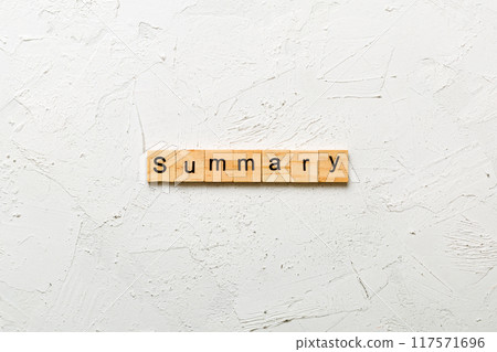 Summary word written on wood block. Summary text on table, concept 117571696