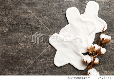 set of colorful bright reusable menstrual pads with cotton flower. zero waste woman periods concept top view with copy space 117571855
