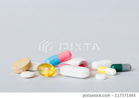 Many different colorful medication and pills perspective view. Set of many pills on colored background Many different colorful medication and pills perspective view. Set of many pills on colored background 117571895