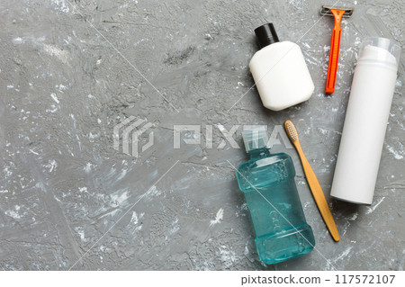 Composition with bath cosmetics on table. razor, toothpaste, soap, gel, toothbrush, mouthwash and other various accessories. Cosmetics for skin health. Bath Mockup for your logo Composition with bath cosmetics on table. razor, toothpaste, soap, gel, toothbrush, mouthwash and other various accessories. Cosmetics for skin health. Bath Mockup for your logo 117572107
