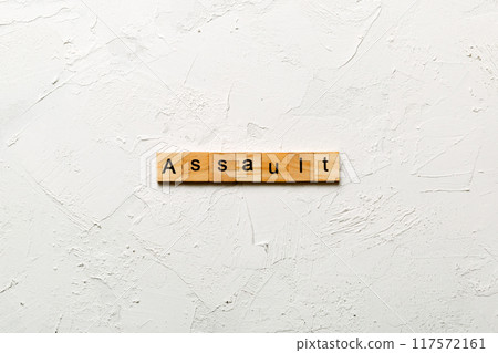 assault word written on wood block. assault text on table, concept 117572161