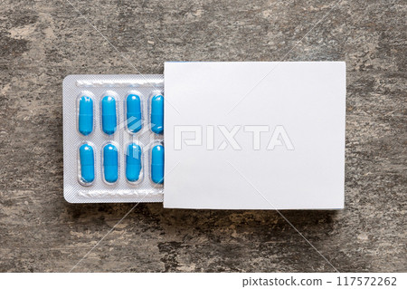 Blank White Product Package Box Mock-up. Open blank medicine drug box with blue pills blister top view Blank White Product Package Box Mock-up. Open blank medicine drug box with blue pills blister top view 117572262