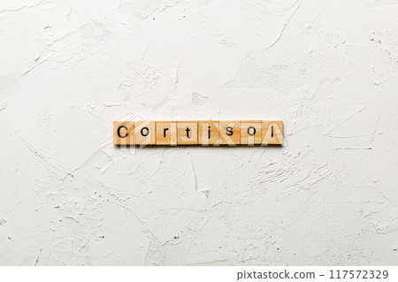 Cortisol word written on wood block. Cortisol text on cement table for your desing, Top view concept 117572329