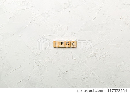 IPCC word written on wood block. abbreviation Intergovernmental Panel on Climate Change text on cement table for your desing, concept 117572334