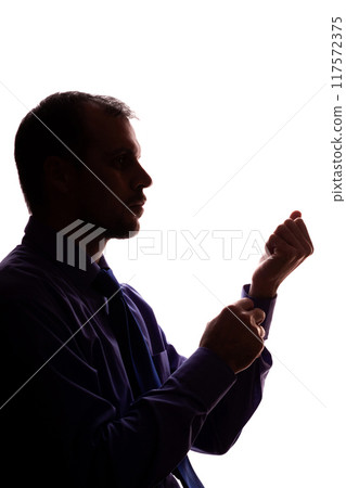 Thoughtful young unshaven man, business clothes, silhouette - white background isolate 117572375