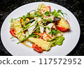 Mixed salad with seafood, tomato and Mozzarella cheese 117572952