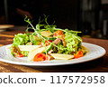 Salad with beef tongue, cheese, tomatoes, lettuce and cucumbers 117572958