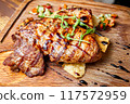 Veal with vegetable ratatouille and pepper sauce 117572959