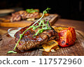Veal with vegetable ratatouille and pepper sauce 117572960
