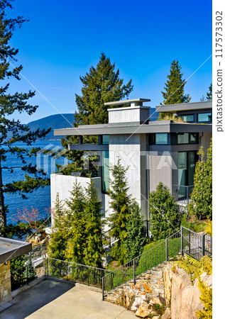 Corner of a residential house with Pacific ocean bay overview Corner of a residential house with Pacific ocean bay overview 117573302