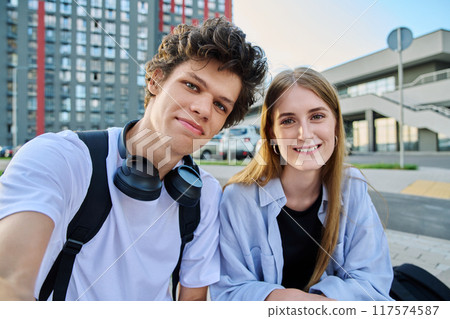 Portrait of young students guy and girl, outdoors together 117574587