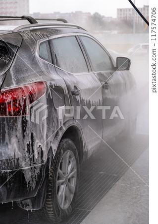 SUV Being Washed at Car Wash 117574706