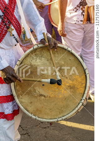 Drum player during a religious festival Drum player during a religious festival 117575160