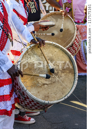 Drummers with rustic and colorful wooden drums Drummers with rustic and colorful wooden drums 117575161