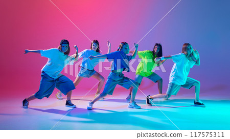 Five kids strike dynamic hip hop poses with intense focus and style against gradient pink purple background in neon light Five kids strike dynamic hip hop poses with intense focus and style against gradient pink purple background in neon light 117575311