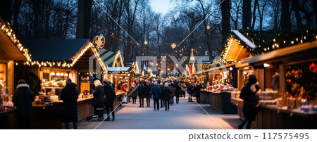 People walking on crowdy street discovering delights at festive Christmas market. Snowy square decorated with garlands. 117575495
