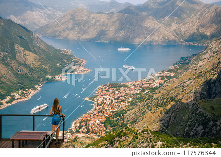 Woman Tourist Enjoying Views on Kotor Serpentine Woman Tourist Enjoying Views on Kotor Serpentine 117576344