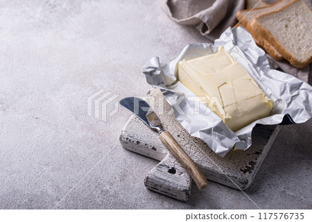 Fresh butter on grey backgrouns. 117576735
