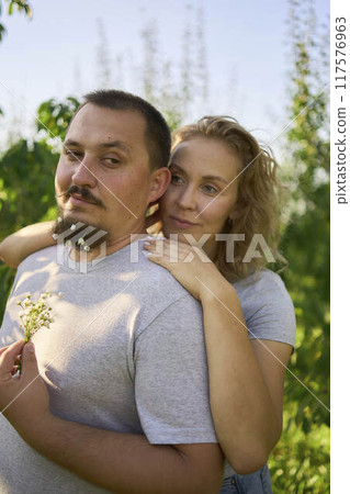 a middle-aged couple in love in the garden 117576963