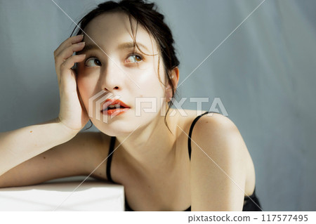 Portrait of a woman in a black dress Portrait of a woman in a black dress 117577495