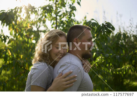 a middle-aged couple in love in the garden a middle-aged couple in love in the garden 117577697