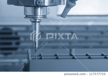 The CNC milling machine cutting the graphite electrode parts in the light blue scene. The CNC milling machine cutting the graphite electrode parts in the light blue scene. 117577710