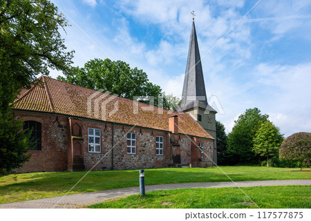 The catholic Saint Andrew church in the village center, Hollenstedt, Lower Saxony, Germany 117577875