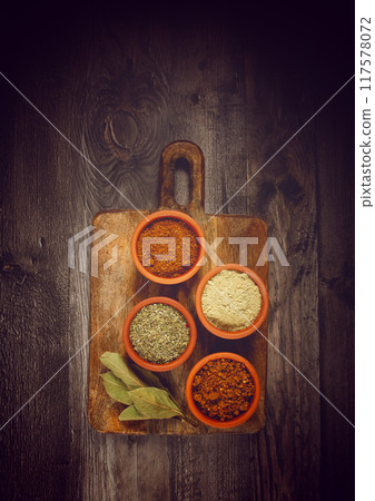 Georgian spices, in ceramic bowls, assortment, set of spices, utsho, adjika, Svan salt, ground coriander, top view, no people, Georgian spices, in ceramic bowls, assortment, set of spices, utsho, adjika, Svan salt, ground coriander, top view, no people, 117578072