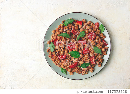 Tuscan pasta with smoked paprika and basil,parmesan cheese, Italian traditional cuisine, Tuscan pasta with smoked paprika and basil,parmesan cheese, Italian traditional cuisine, 117578228