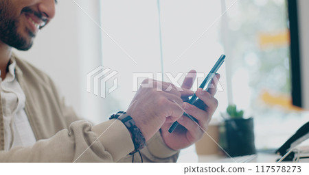 Happy man, phone in office and scroll on social media, email or post for business networking. Hands typing, good news and businessman with mobile app on smartphone, chat online and smile at work desk 117578273