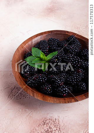 blackberries, in a wooden bowl, top view, no people, 117578313