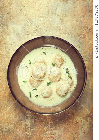 ravioli in cream sauce, spices and herbs, top view, no people, 117578370
