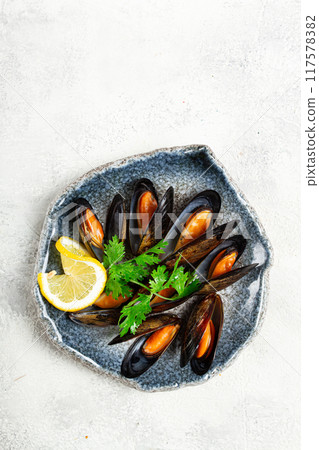 mussels in shells, boiled in their own juice, in a bowl, gray background, top view, homemade , no people, mussels in shells, boiled in their own juice, in a bowl, gray background, top view, homemade , no people, 117578382