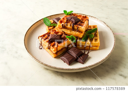 Viennese waffles, with chocolate, breakfast, on a beige background, no people, selective focus, Viennese waffles, with chocolate, breakfast, on a beige background, no people, selective focus, 117578389