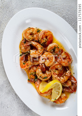fried tiger prawns, jumbo, in garlic sauce, in butter, with herbs, on a white plate, homemade, no people, fried tiger prawns, jumbo, in garlic sauce, in butter, with herbs, on a white plate, homemade, no people, 117578395
