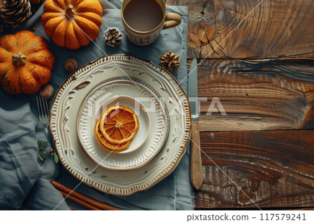 Rustic holiday table setup: Top view of empty plates and glasses with pumpkin decorations on a wooden table. Empty space for your text or advert. Ai generative 117579241
