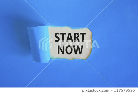 Start now symbol. Concept words Start now on beautiful white paper. Beautiful blue table blue background. Business marketing, motivational start now concept. Copy space. Start now symbol. Concept words Start now on beautiful white paper. Beautiful blue table blue background. Business marketing, motivational start now concept. Copy space. 117579550