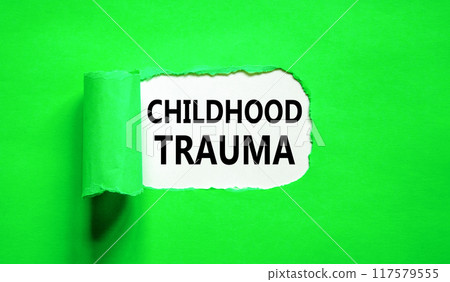 Childhood trauma symbol. Concept words Childhood trauma on beautiful white paper. Beautiful green paper background. Business psychology childhood trauma concept. Copy space. Childhood trauma symbol. Concept words Childhood trauma on beautiful white paper. Beautiful green paper background. Business psychology childhood trauma concept. Copy space. 117579555