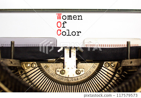 WOC women of color symbol. Concept words WOC women of color typed on beautiful old retro typewriter. Beautiful white background. Business WOC women of color social issues concept. Copy space. WOC women of color symbol. Concept words WOC women of color typed on beautiful old retro typewriter. Beautiful white background. Business WOC women of color social issues concept. Copy space. 117579573