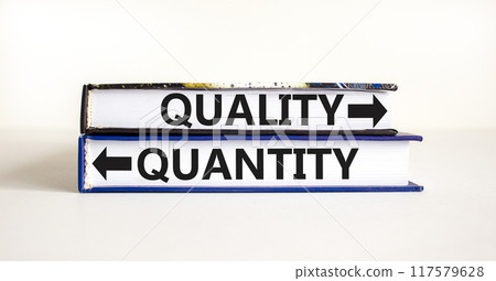 Quantity or quality symbol. Concept word Quantity or Quality on beautiful books. Beautiful white table white background. Business quantity or quality concept. Copy space. Quantity or quality symbol. Concept word Quantity or Quality on beautiful books. Beautiful white table white background. Business quantity or quality concept. Copy space. 117579628